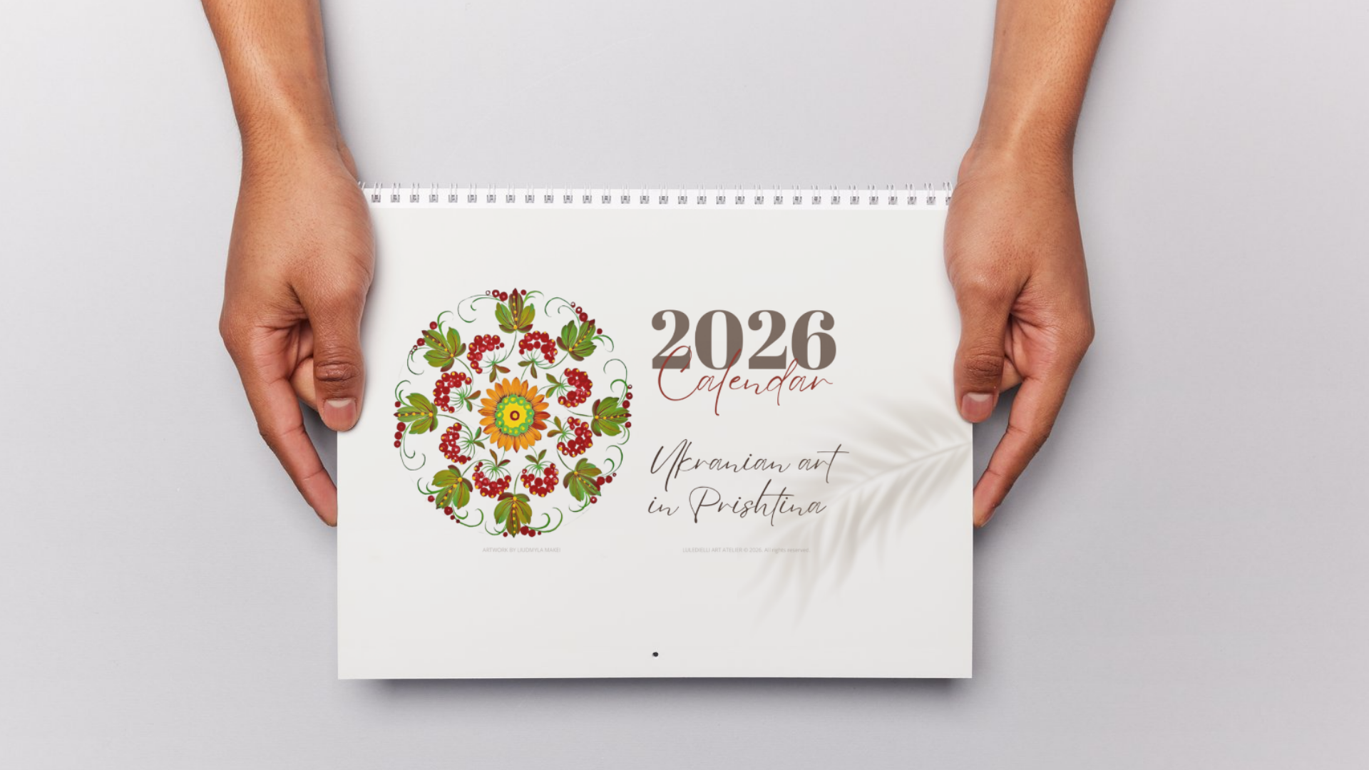 2026 Ukrainian Art Calendar cover held in hands